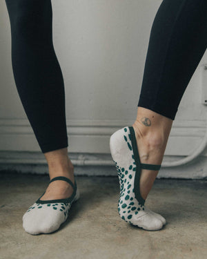 Dots Dance Grip Sock barely there. A low profile and delicate strap make sure you're always on pointe.