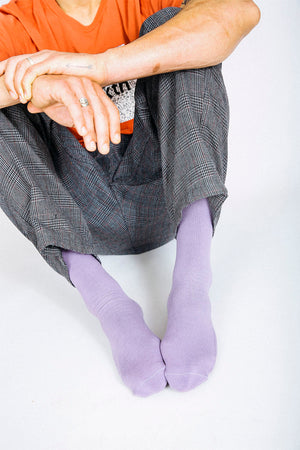 Man wearing Tailored Union purple crew socks