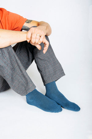 Man wearing Tailored Union blue crew socks