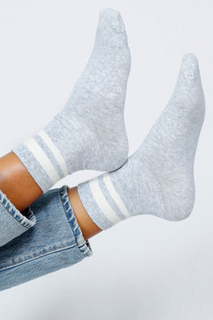 Close up photo of woman's feet wearing Tailored Union baseball ankle socks 