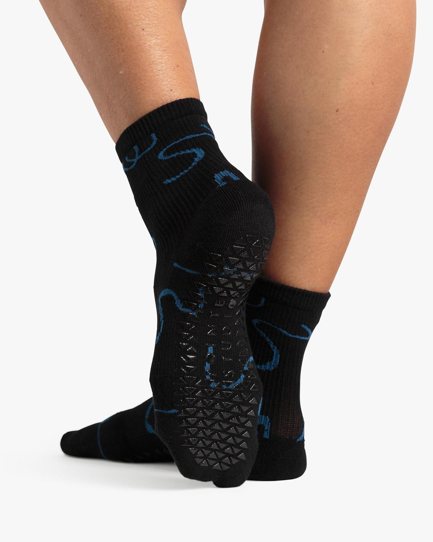 Combed Cotton  Midweight Terry Footbed  PVC Grip  Compression Arch Support  Above Ankle Coverage